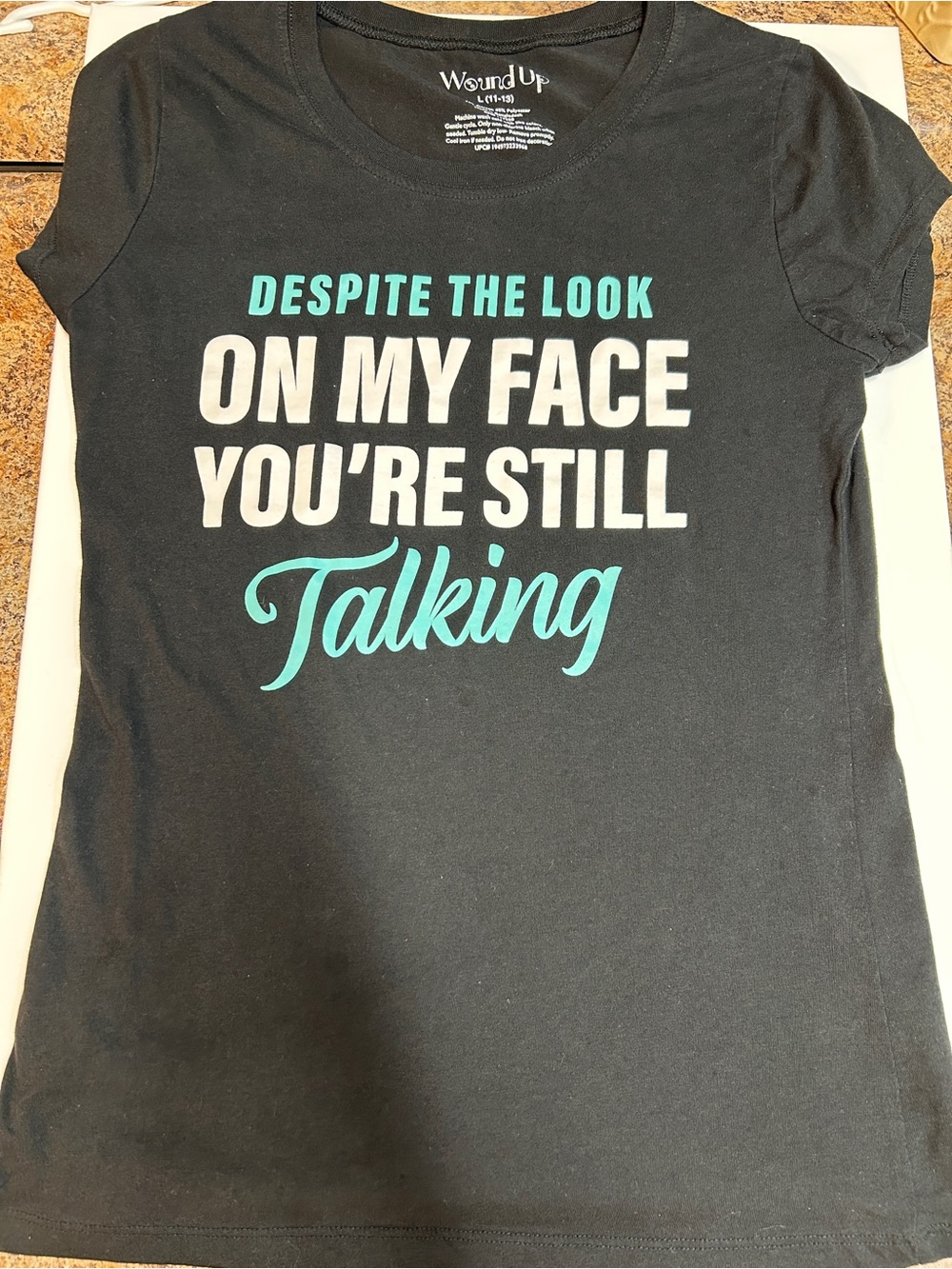 Wound Up Black Graphic Tee with Turquoise and White Slogan